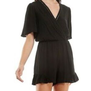 ‼️SOLD‼️ Lily Rose Black Romper.  Flared Ruffle Leg